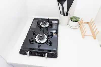a stove top oven sitting on top of a counter at \u5c0f\u718aAnnex 129Tb in Tokyo