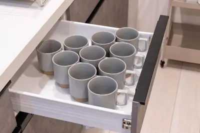 a drawer with a bunch of coffee cups on it at \u5922\u306e\u5bbf \u6b05 138t in Tokyo