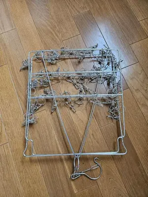 a pile of metal objects on a wooden floor at \u30db\u30c6\u30eb\u30ec\u30b9\u30dd\u30ef\u30fc\u30eb303 in Tokyo