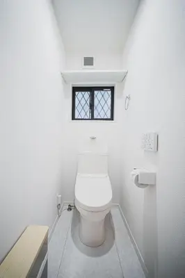 a white bathroom with a toilet with a window at 18min to Disney by Taxi Luxury Mattress 3BR 74 square meter in Tokyo