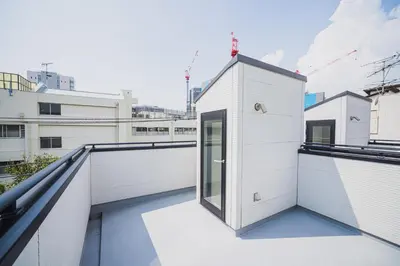 a view from the balcony of a white building at 18min to Disney by Taxi Luxury Mattress 3BR 74 square meter in Tokyo
