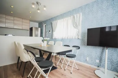 a kitchen and dining room with a table and chairs at 18min to Disney by Taxi Luxury Mattress 3BR 74 square meter in Tokyo