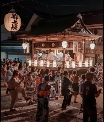 a group of people dancing in front of a building at PR54 Winter Tokyo Shinjuku Xmas Lights New Year Shrine in Tokyo