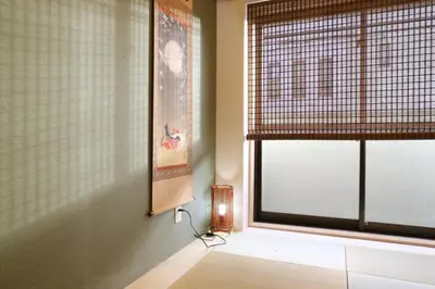 a room with a window with a lamp next to it at Maple Ginkgo Views Autumn Stay Up To 8 in Tokyo