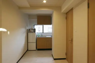 a small kitchen with a sink and a refrigerator at Maple Ginkgo Views Autumn Stay Up To 8 in Tokyo
