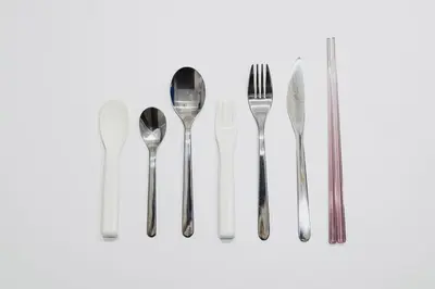 a group of silver cutlery on a white background at 4K Cinema Duplex, 8 Guests, 4 min in Tokyo
