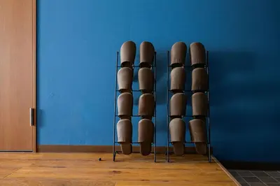 a group ofools sitting against a blue wall at 4K Cinema Duplex, 8 Guests, 4 min in Tokyo