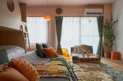 a living room with a couch and a table at 4K Cinema Duplex, 8 Guests, 4 min in Tokyo