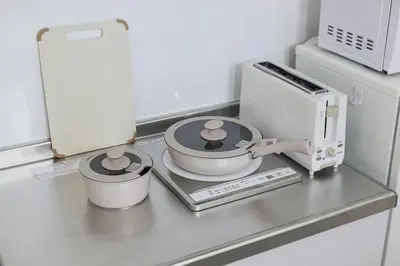 a kitchen counter with a mortar and pestle on a stove at Pop playful accommodation for family, 4 people, 4 min in Tokyo