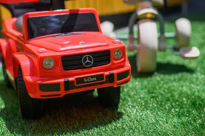 a red toy truck sitting in the grass at Pop playful accommodation for family, 4 people, 4 min in Tokyo