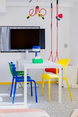 a room with a table and chairs and a tv at Pop playful accommodation for family, 4 people, 4 min in Tokyo