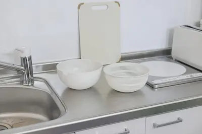 a kitchen counter with three bowls and a sink at Pop playful accommodation for family, 4 people, 4 min in Tokyo