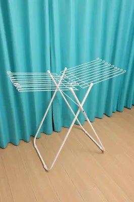 a metal table in front of a blue curtain at \u5800\u52074\u4e01\u76ee\u6238\u5efa in Tokyo