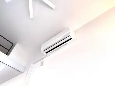 a white air conditioner hanging from a ceiling at 東京最上階の豪邸ステイ 最上階270度ビュー&スカイツリーを望む 最大8名貸切 上野浅草秋葉原近く 無料WiFi アルカディア北千住 in Tokyo