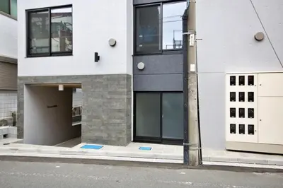 a building on the side of a street at Heureux\u690e\u540d\u753a202 in Tokyo