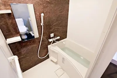 a bathroom with a sink and a shower in it at Relax Family Inn IKEBUKURO in Tokyo