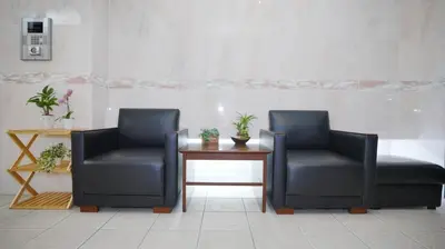 two chairs and a table in a waiting room at LIO HOTEL Tokyo Nippori in Tokyo