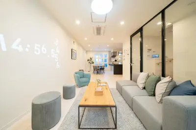 a living room with a couch and a table at Starry Stay House Shibuya I in Tokyo