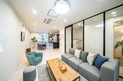 a living room with a couch and a table at Starry Stay House Shibuya I in Tokyo