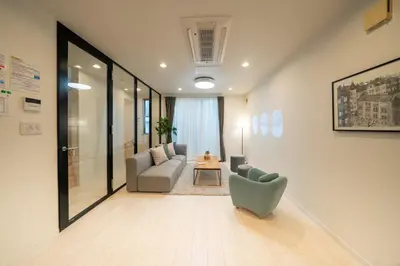 a living room with a couch and a chair at Starry Stay House Shibuya I in Tokyo