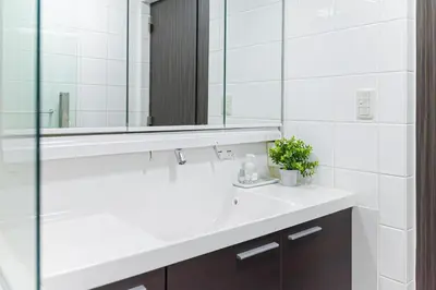 a bathroom with a white sink and a mirror at Starry Stay House Shibuya I in Tokyo