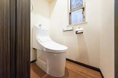 a white toilet in a bathroom with a window at Starry Stay House Shibuya I in Tokyo