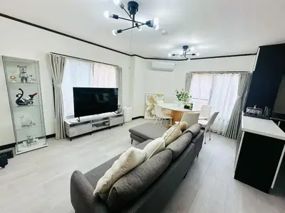 a living room with a couch and a tv and a table at \u6c5f\u5143Skytree in Tokyo