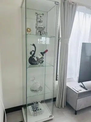 a glass shelf with items on it next to a window at \u6c5f\u5143Skytree in Tokyo