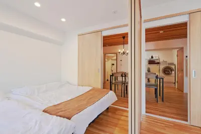 a bedroom with a bed and a dining room at V Close to Shinjuku Kabukicho Korean Town FrWIFI N in Tokyo