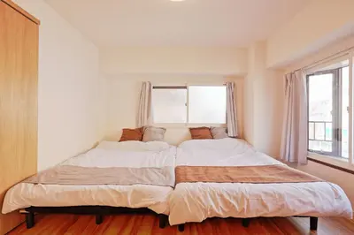 a large bed in a bedroom with a window at V Close to Shinjuku Kabukicho Korean Town FrWIFI N in Tokyo