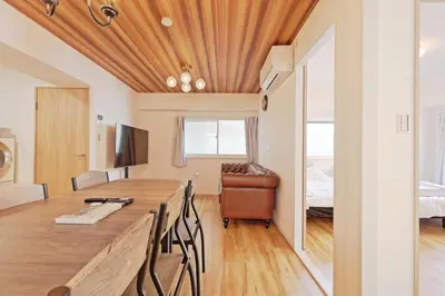 a room with a desk and a bedroom with a bed at V Close to Shinjuku Kabukicho Korean Town FrWIFI N in Tokyo