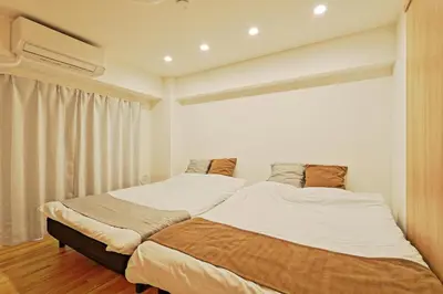 a bedroom with two beds and a window at V Close to Shinjuku Kabukicho Korean Town FrWIFI N in Tokyo