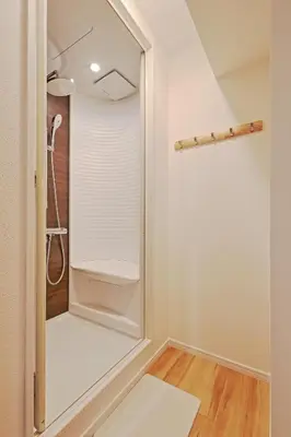 a walk in shower in a bathroom with a mirror at V Close to Shinjuku Kabukicho Korean Town FrWIFI N in Tokyo