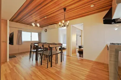 a dining room with a wooden ceiling and a table and chairs at V Close to Shinjuku Kabukicho Korean Town FrWIFI N in Tokyo