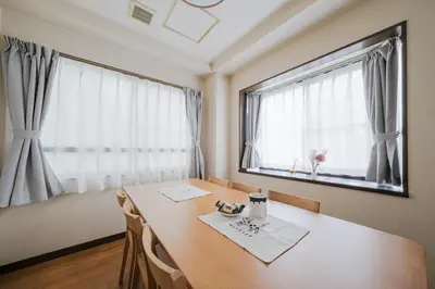 a dining room with a table and a large window at Asakusa 2BR Apt Kitchen 8P \u6d45\u83492LDK \u30ad\u30c3\u30c1\u30f3\u4ed8 \u6700\u59278\u540d in Tokyo