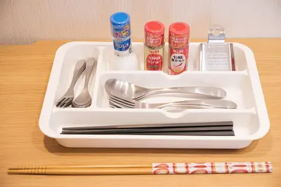 a white tray with utensils and condiments on a table at Pet\u767e\u4eba\u753a1\u4e01\u76ee202 in Tokyo