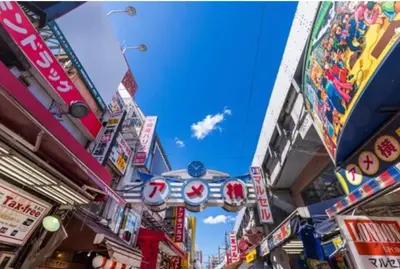 a city street filled with lots of signs at Pet\u767e\u4eba\u753a1\u4e01\u76ee202 in Tokyo