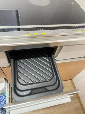 an empty oven in a kitchen with its door open at \u9280\u5ddd\u306e\u5bbf in Tokyo