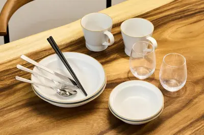 a table with plates and glasses on a wooden table at \u3077\u3075\u304b\u548c\u83dc\u9418\u30f6\u6df5 in Tokyo
