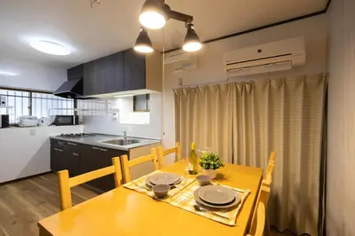 a kitchen and dining room with a table and chairs at -Shibamata House- 9-minute walk from Shibamata Station in Tokyo