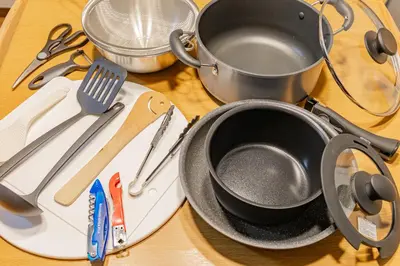 a table with a frying pan and utensils on it at -Shibamata House- 9-minute walk from Shibamata Station in Tokyo