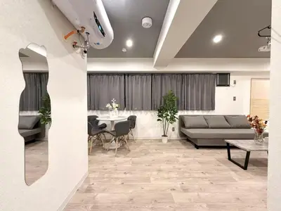 a living room with a couch and a table at \u30af\u30ea\u30b9\u30bf\u30eb\u9ad8\u7530\u99ac\u5834 201 in Tokyo