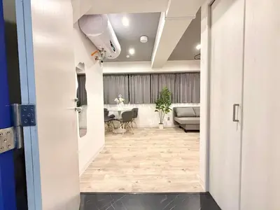 an open door to a living room with a table at \u30af\u30ea\u30b9\u30bf\u30eb\u9ad8\u7530\u99ac\u5834 201 in Tokyo