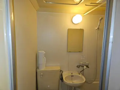 a small bathroom with a toilet and a sink at \u30db\u30c6\u30eb\u30ec\u30b9\u30dd\u30ef\u30fc\u30eb301 in Tokyo