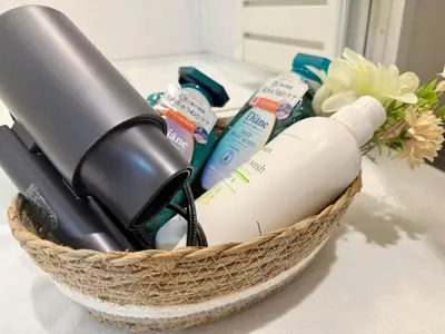 a basket with a hair dryer and other products on a counter at \u30af\u30ea\u30b9\u30bf\u30eb\u9ad8\u7530\u99ac\u5834 301 in Tokyo