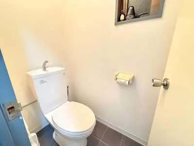 a bathroom with a white toilet and a mirror at \u30af\u30ea\u30b9\u30bf\u30eb\u9ad8\u7530\u99ac\u5834 501 in Tokyo