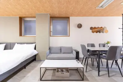 a hotel room with a bed and a table at Spacious Private Hotel Floor for up to 16 Guests about 10 minute walk from JR Ryogoku Station HOTEL Musashi Tokyo Ryogoku in Tokyo
