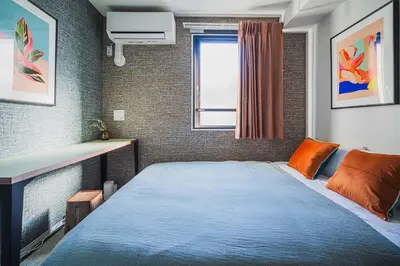 a small bedroom with a bed and a window at 2 min by train to Shibuya New 3rd floor 19 square meters in Tokyo