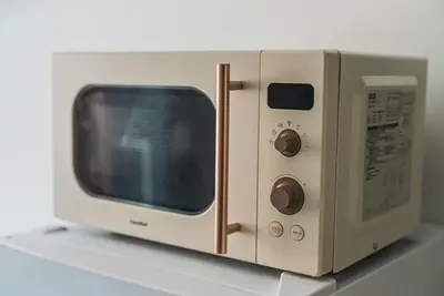 a white microwave oven sitting on top of a shelf at 2 min by train to Shibuya New 3rd floor 19 square meters in Tokyo