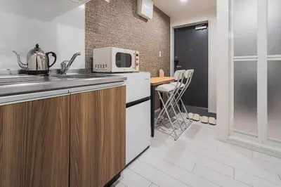a kitchen with a sink and a microwave at 2 min by train to Shibuya New 3rd floor 19 square meters in Tokyo